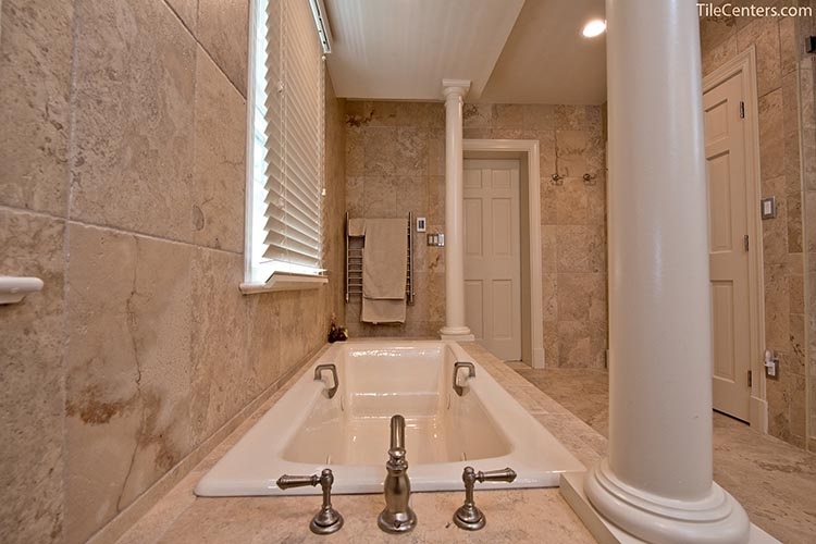 Bathtub with Beige Tile and Brushed Nickel Faucets