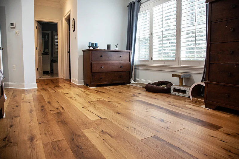 Professional hardwood floor installation in Rockville, showing natural light-brown wood planks.