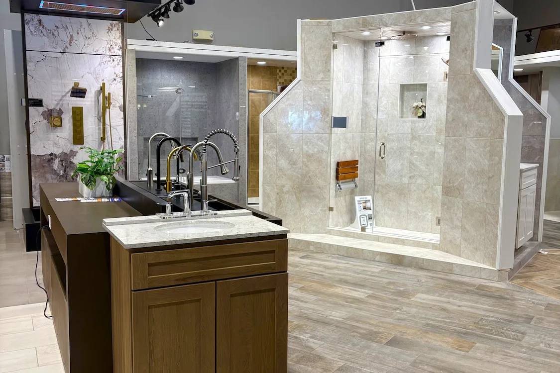 Tile Center kitchen and bath remodeling showroom interior with faucet and bathroom display.